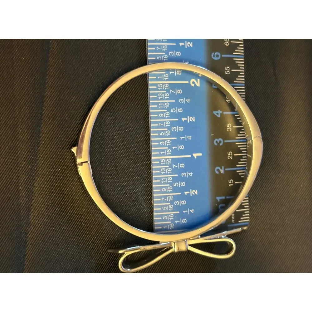Kate Spade Silver Tone Bow Hinged Bangle Size 7